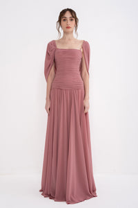 Manel-Fashion VITA DRESS displayed on a hanger, showcasing its elegant design and fabric details.