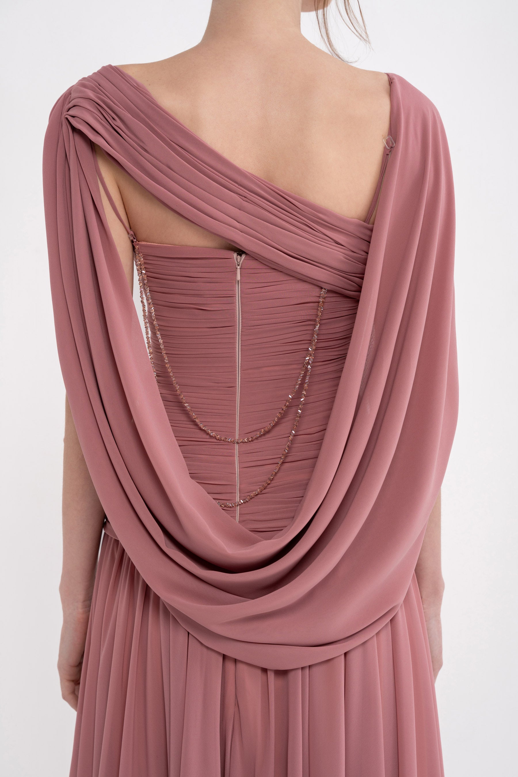 VITA DRESS by MANEL-FASHION displayed on a hanger, featuring a stylish, lightweight dress with a fitted waist and elegant design.