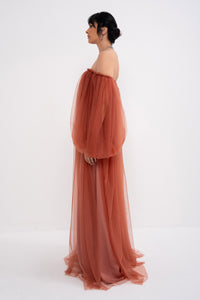 Manel-Fashion Hestia dress in soft fabric with a stylish neckline and elegant fit, perfect for casual or semi-formal occasions.