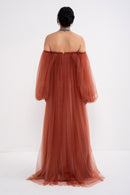 Manel-Fashion Hestia dress in stylish fabric, featuring a fitted bodice and flowing skirt, perfect for elegant occasions.