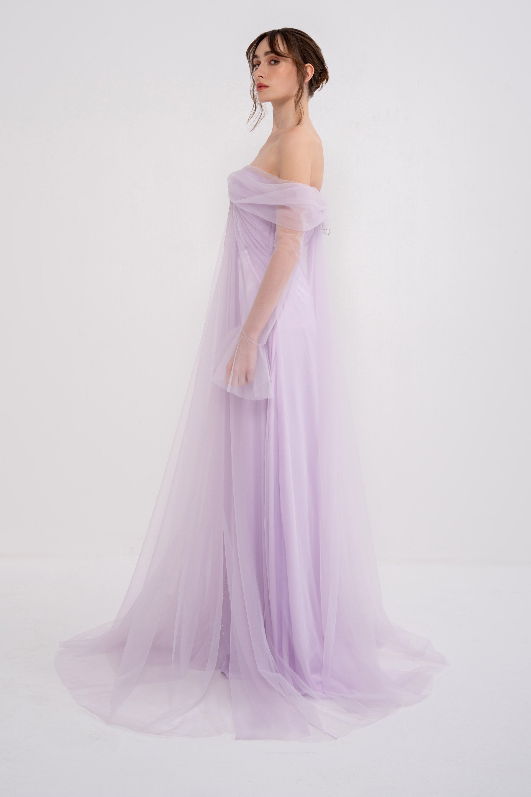 Anthea dress by Manel-Fashion featuring a stylish, flowing design in vibrant fabric, perfect for elegant daytime or evening wear.