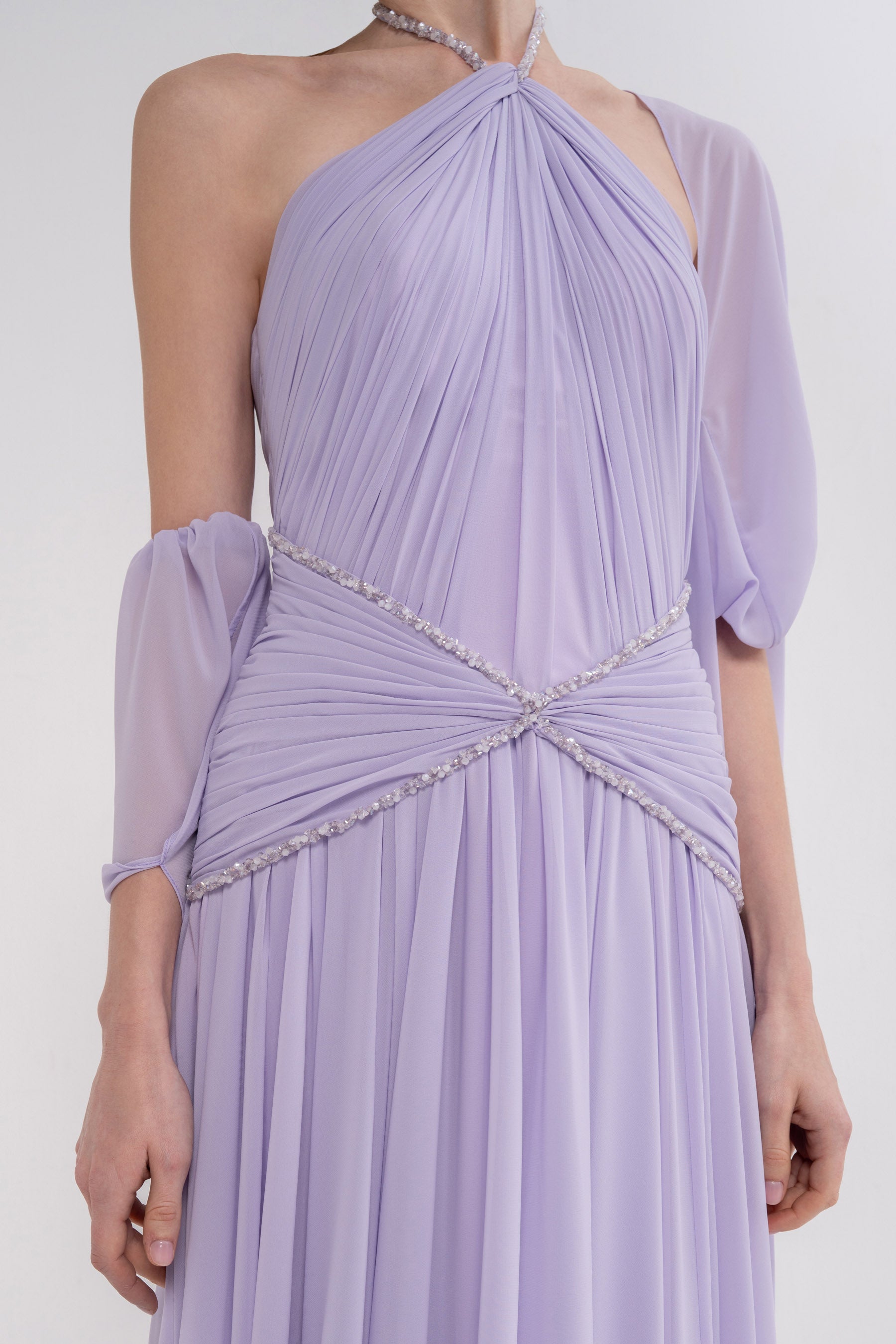 Elegant HERA dress by MANEL-FASHION featuring a stylish, flowing design and vibrant color, perfect for formal or casual occasions.