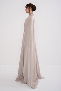 Manel-Fashion Glory Dress displayed on a hanger, featuring a stylish, elegant design suitable for formal or casual occasions.