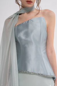 Manel-Fashion Astra set featuring stylish clothing pieces displayed on a hanger, showcasing modern fashion design.