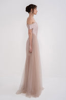 VITTORIA dress by MANEL-FASHION displayed on a hanger, featuring a stylish design with elegant fabric and a fitted silhouette.