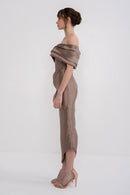 Black NERA dress by Manel-Fashion with elegant fit and stylish design, displayed on a hanger against a neutral background.