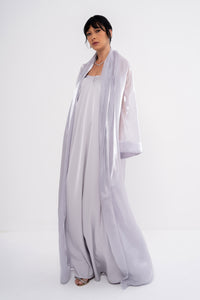 Grey CLEA dress by MANEL-FASHION displayed on a model, showcasing a stylish and elegant women's fashion piece.