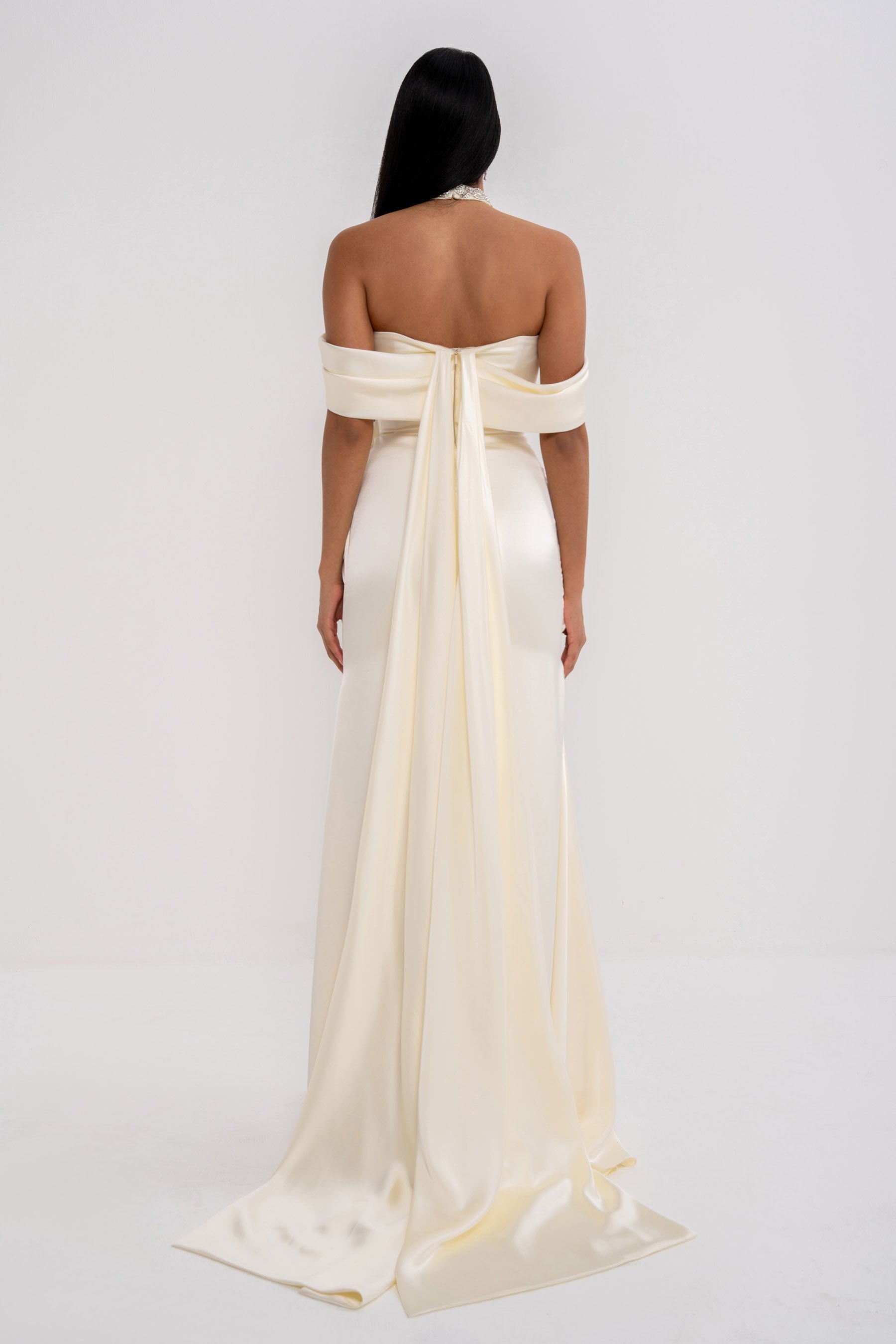 Manel-Fashion Grazia dress in a stylish design, displayed on a hanger with fabric details visible.