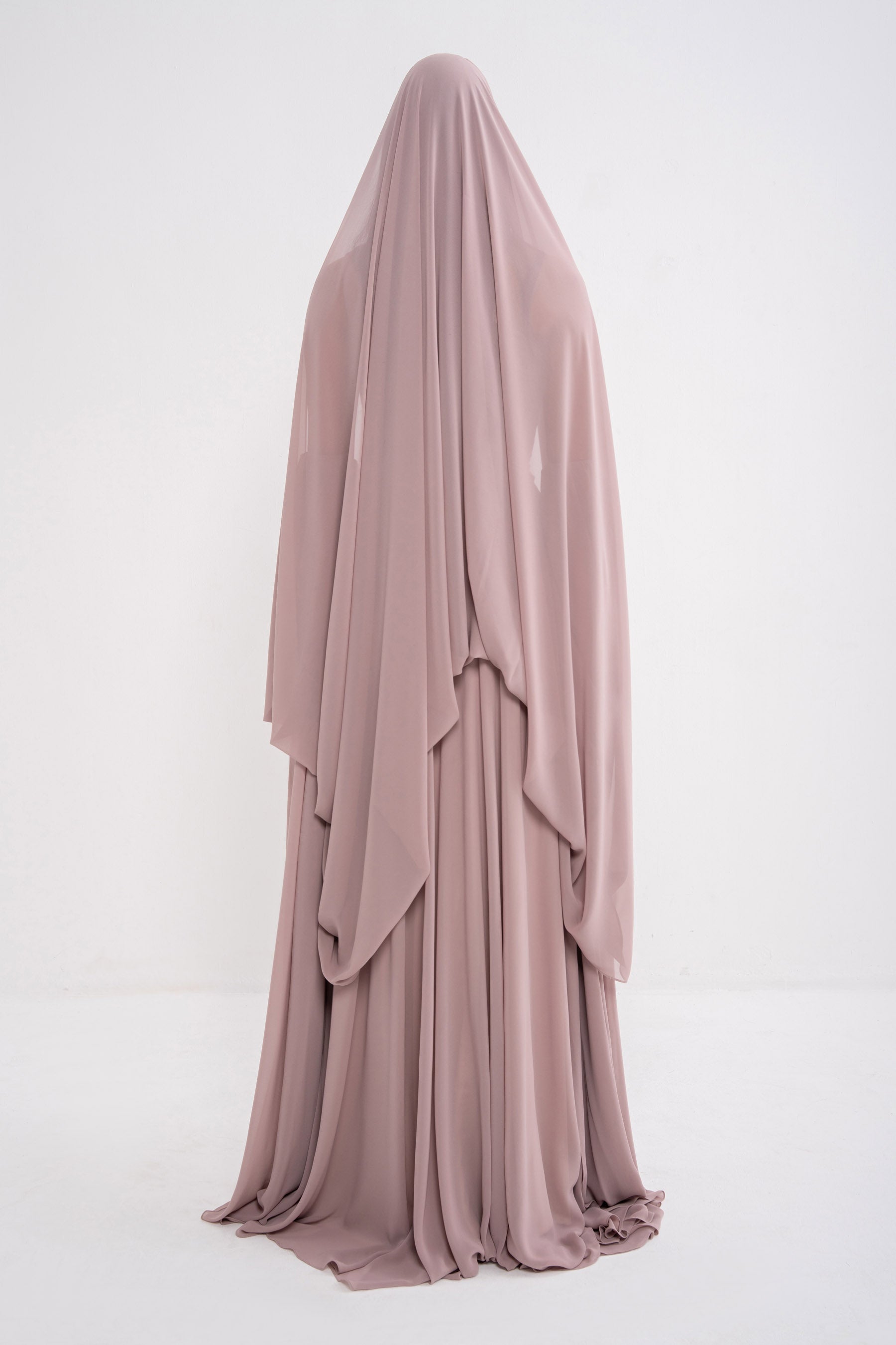 Manel-Fashion Myth Dress featuring a stylish, elegant design with flowing fabric and intricate detailing.