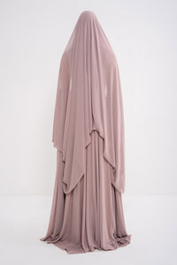 Manel-Fashion Myth Dress featuring a stylish, elegant design with flowing fabric and intricate detailing.