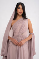 Stylish MYTH DRESS by MANEL-FASHION displayed on a hanger, showcasing its elegant design and fabric details.