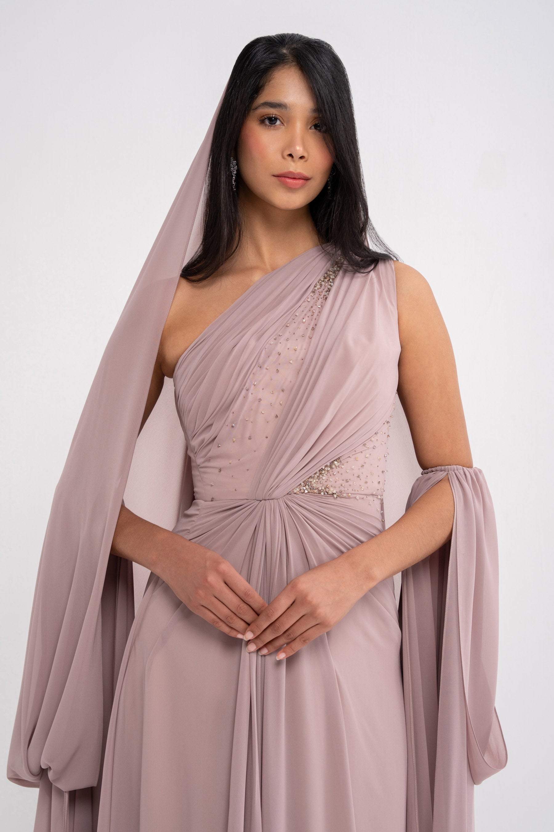 Stylish MYTH DRESS by MANEL-FASHION displayed on a hanger, showcasing its elegant design and fabric details.