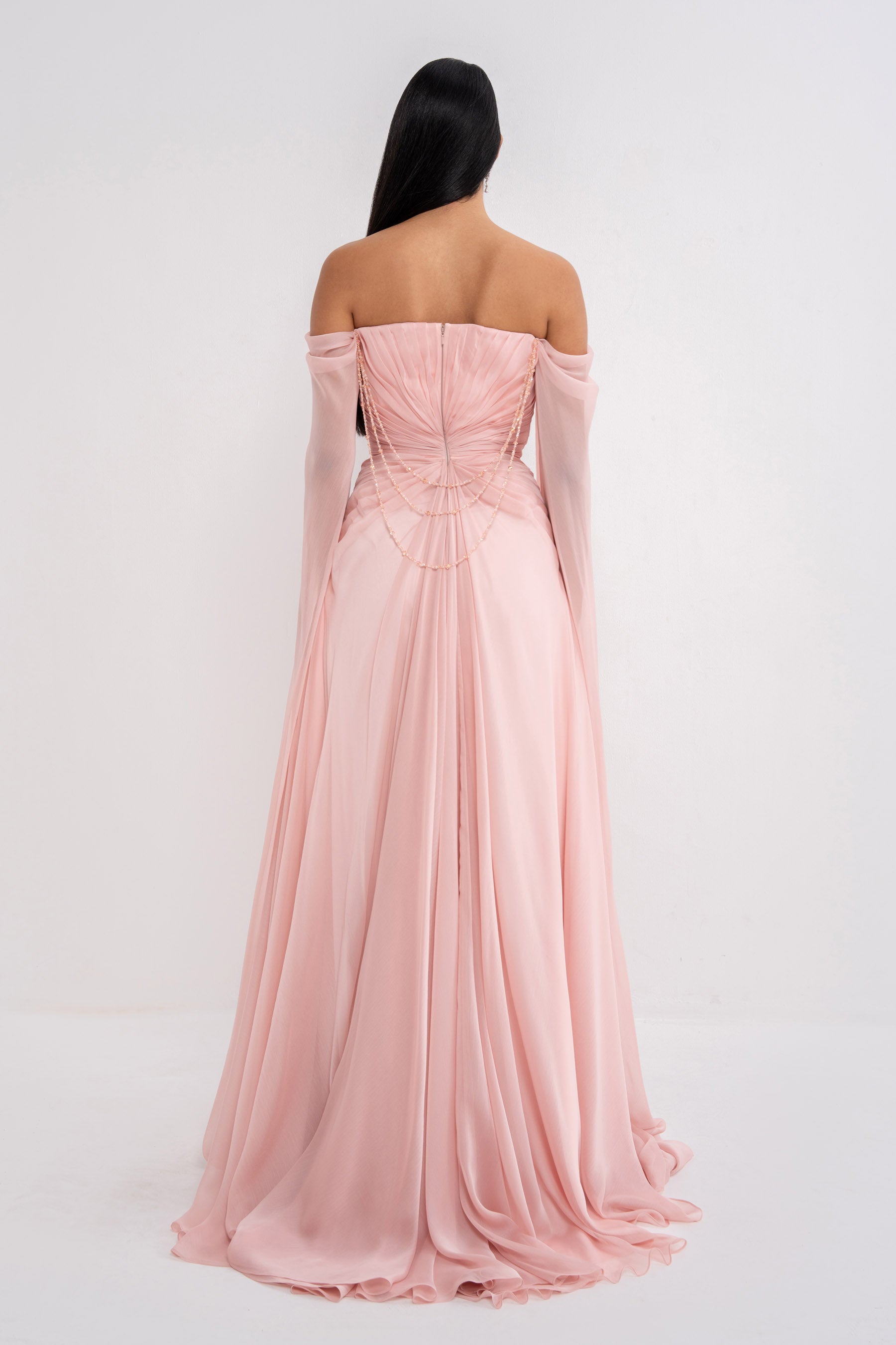 Elegant Aphrodite dress by Manel-Fashion featuring a flowing design and intricate detailing, perfect for stylish occasions.