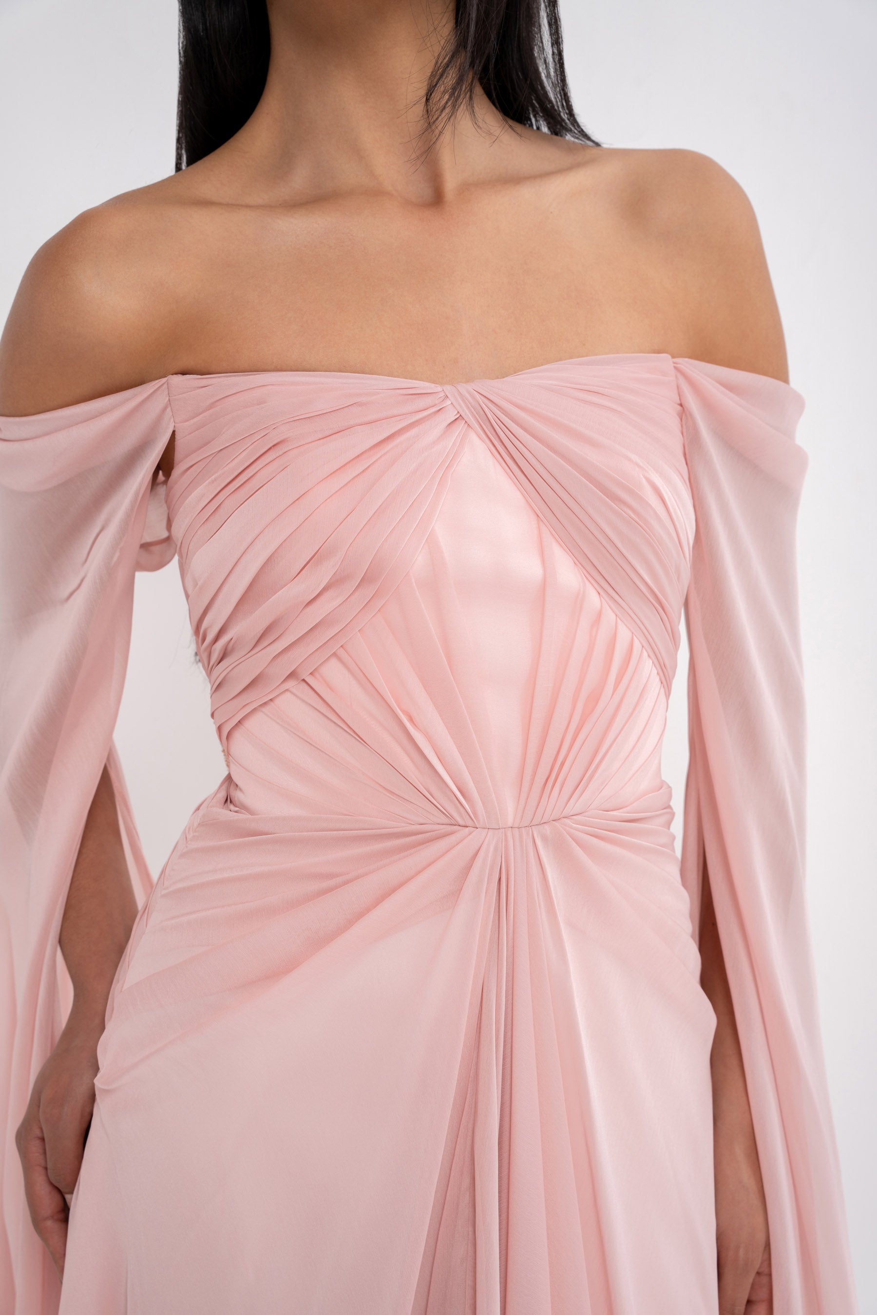 Elegant Aphrodite dress by Manel-Fashion featuring flowing fabric and intricate design, perfect for stylish occasions.