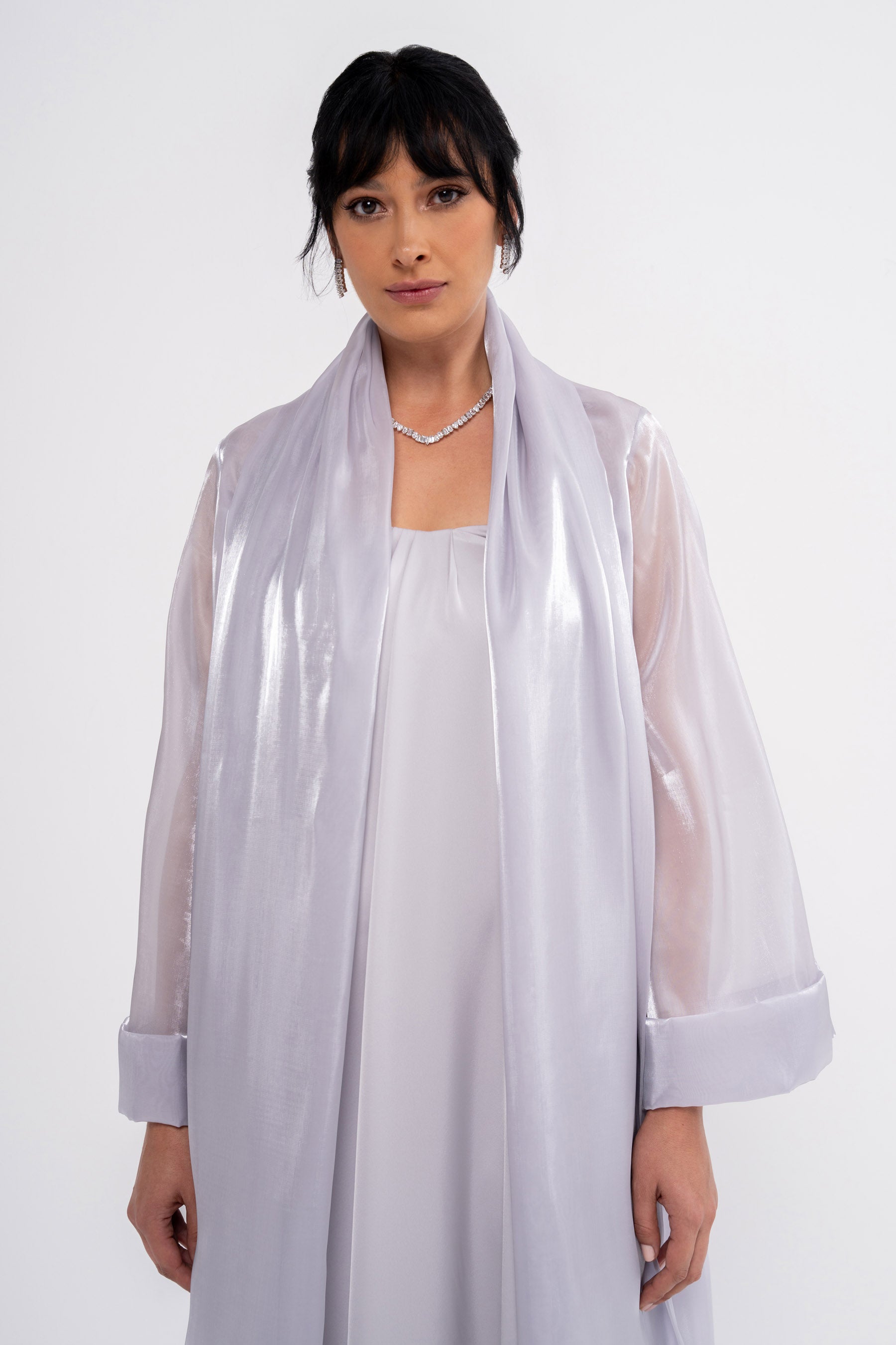 Manel-Fashion CLEA grey dress displayed on a hanger with a simple background, showcasing the stylish, casual women's clothing.