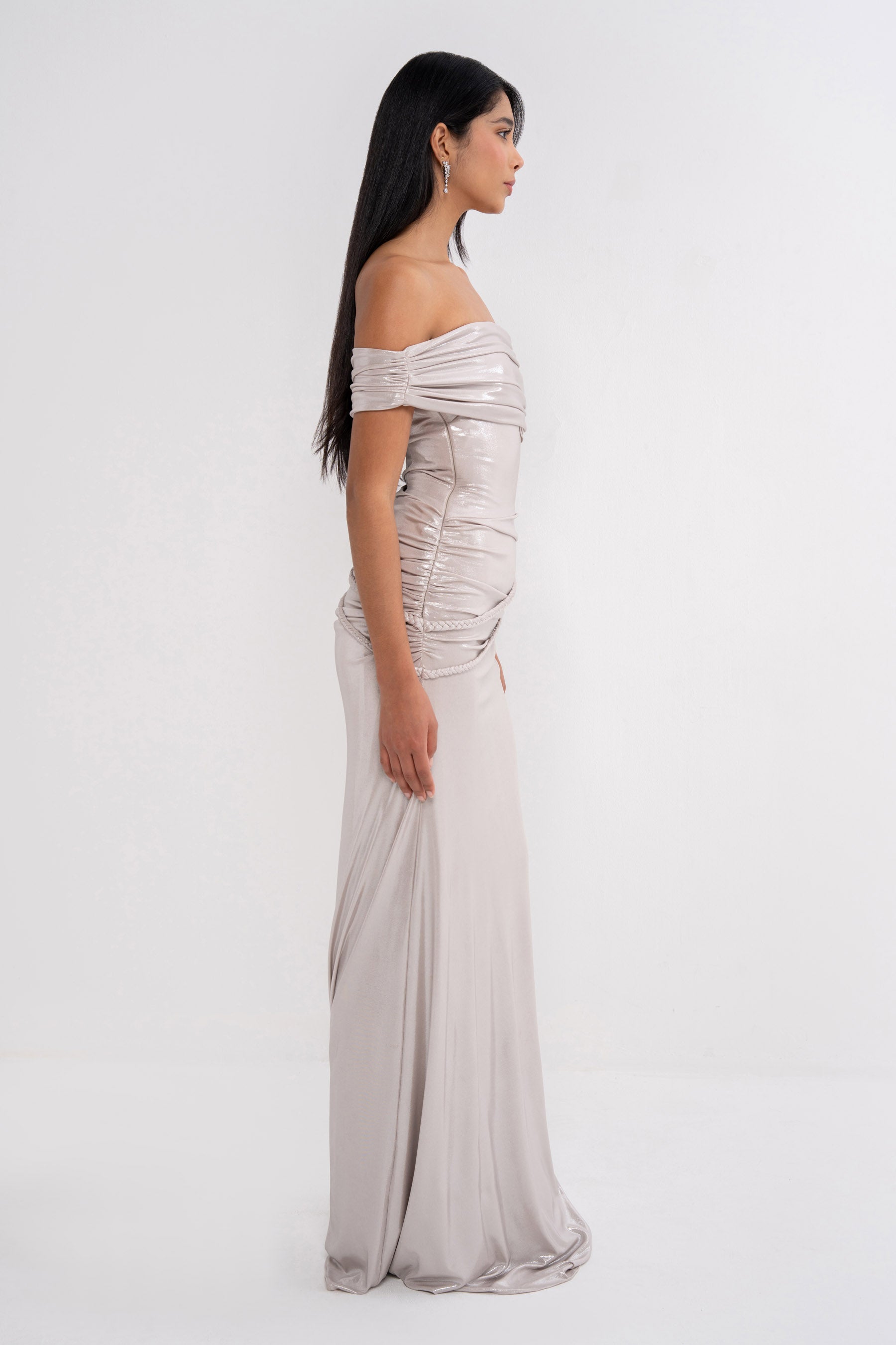 Elegant ELECTRA dress by MANEL-FASHION displayed on a hanger, showcasing its flowing fabric and stylish design.