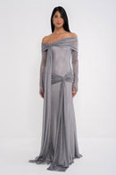 Manel-Fashion Urania dress displayed on a hanger, featuring a stylish design with vibrant fabric and elegant detailing.