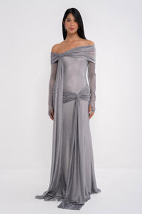 Manel-Fashion Urania dress displayed on a hanger, featuring a stylish design with vibrant fabric and elegant detailing.