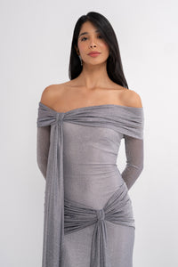 Urania dress by Manel-Fashion featuring a stylish, elegant design with flowing fabric and intricate detailing on a model.