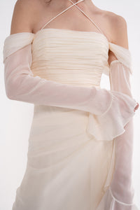 Manel-Fashion Harmonia dress shown in a stylish, flowy design, featuring a vibrant pattern and elegant fit.