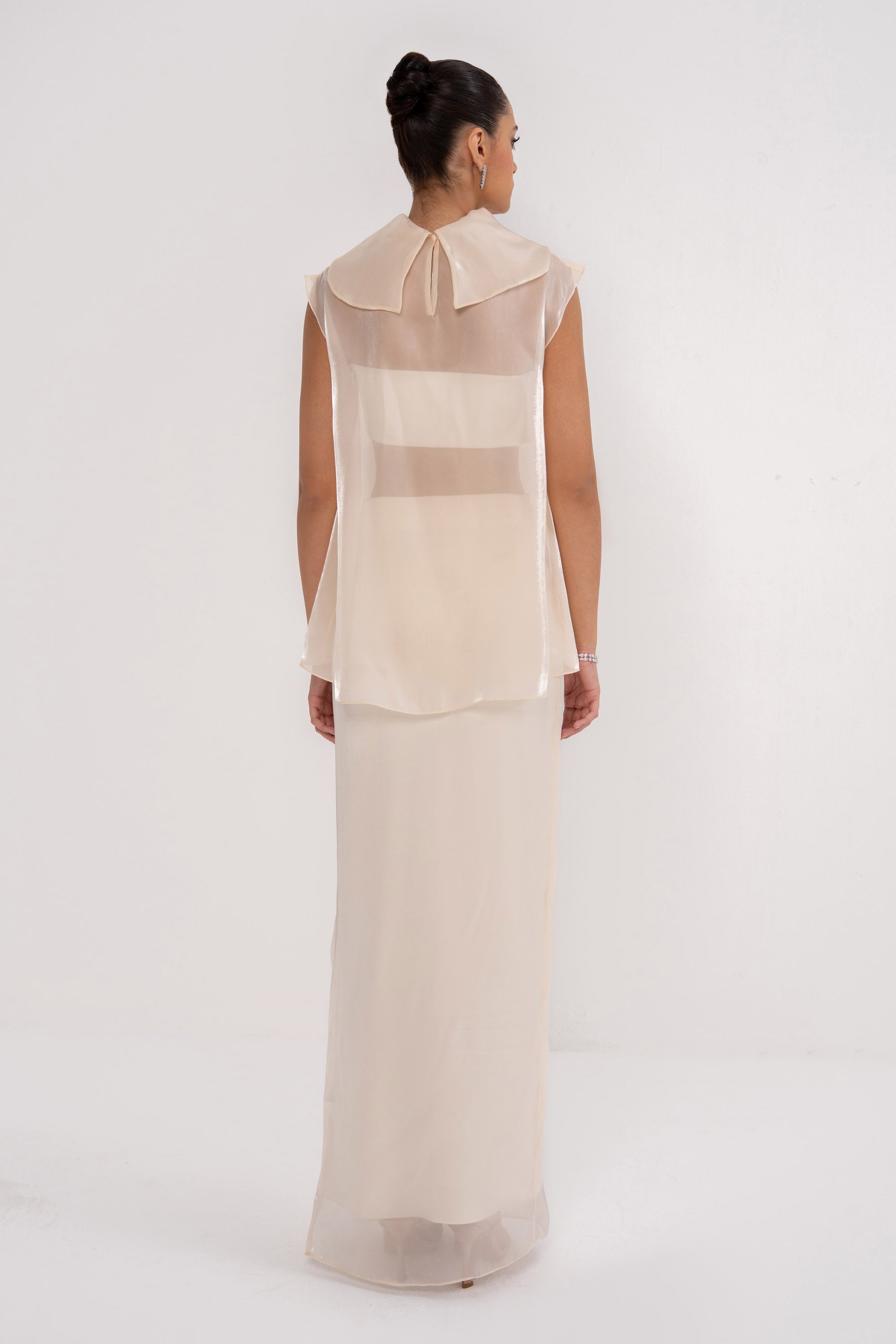 NOVA SET by MANEL-FASHION featuring stylish clothing pieces arranged on a plain background.